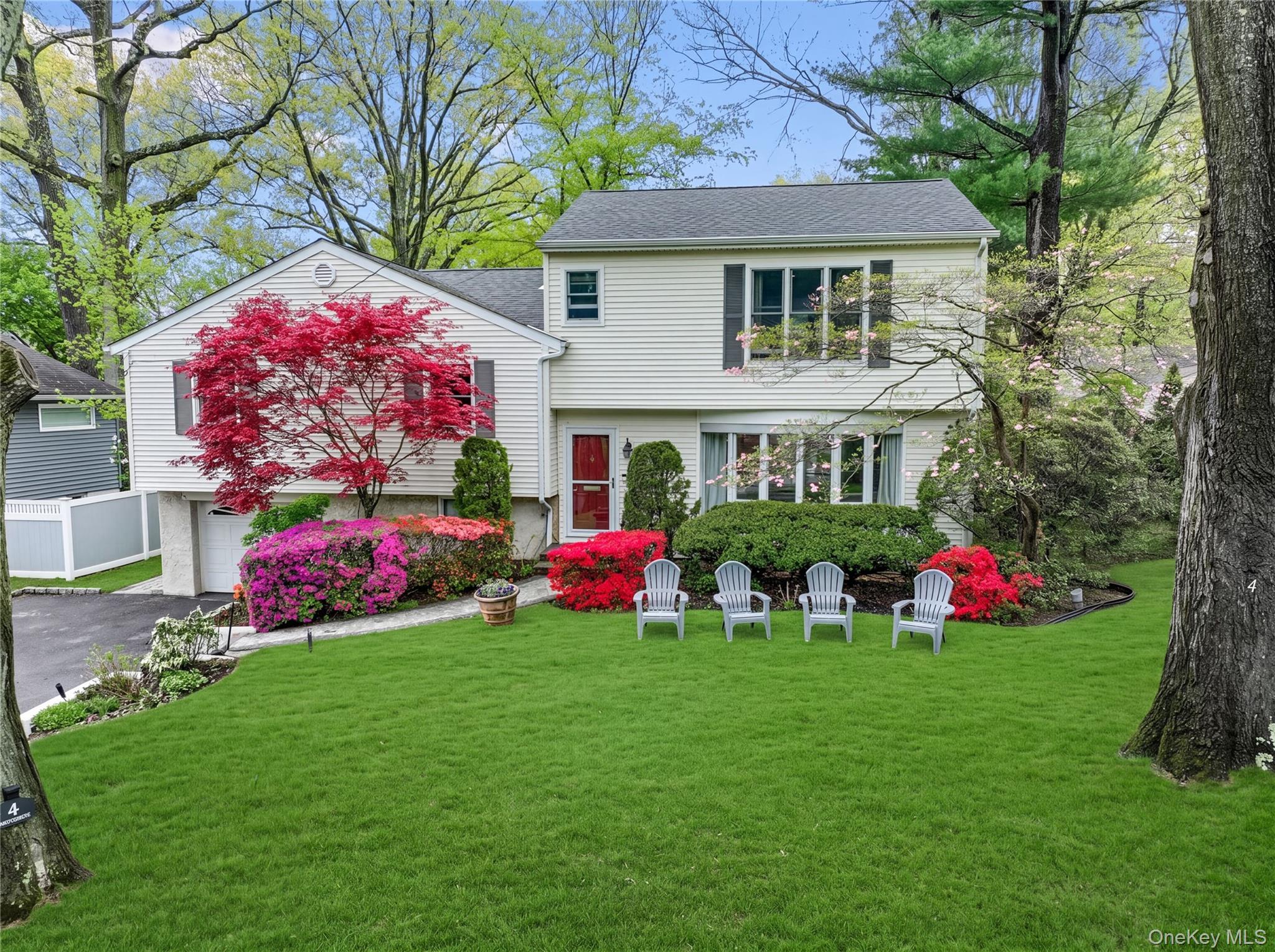 Beautifully renovated and expanded, this split-level home sits on leve...