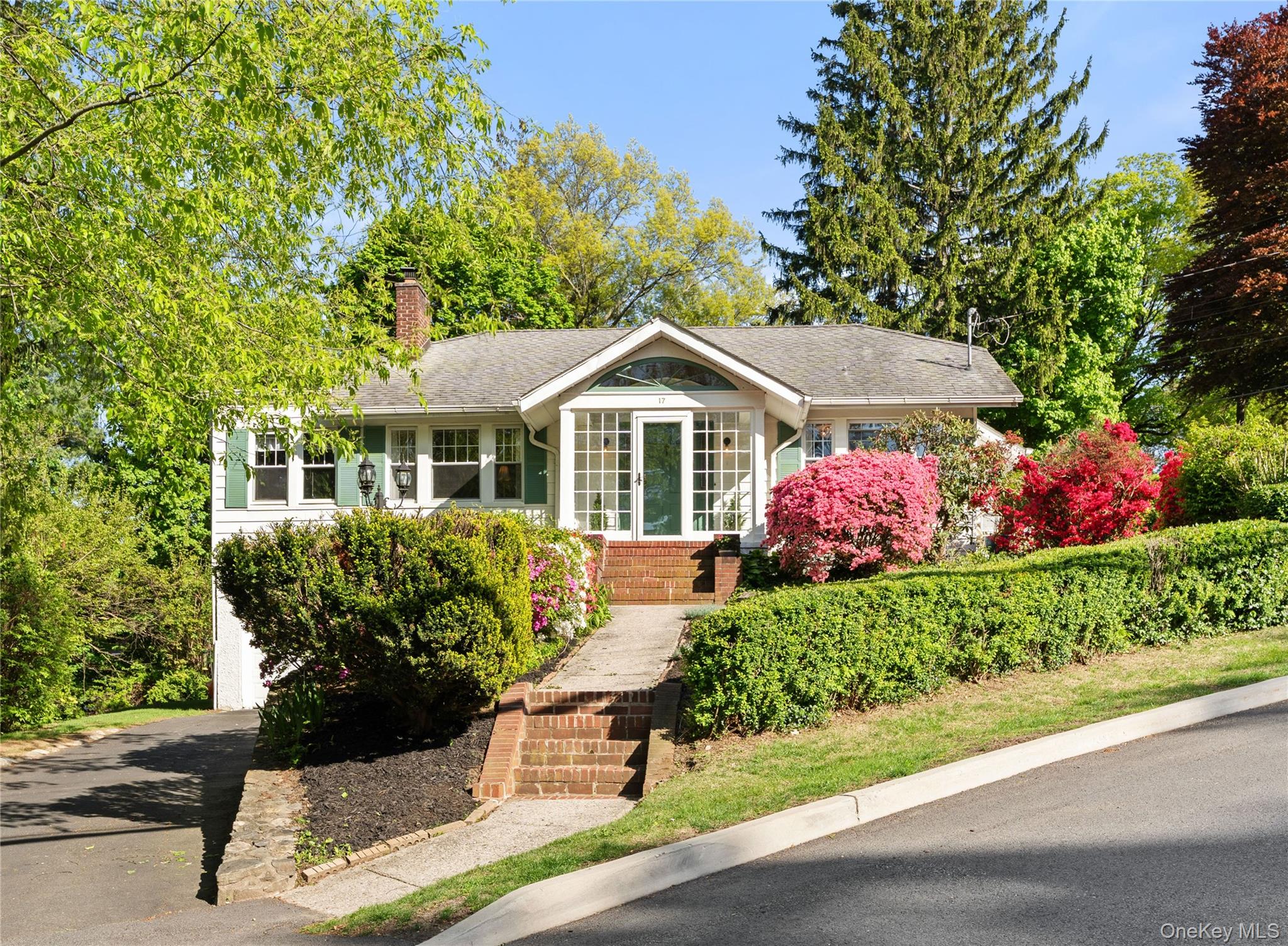 Welcome to this picture-perfect Ardsley ranch, where timeless charm me...