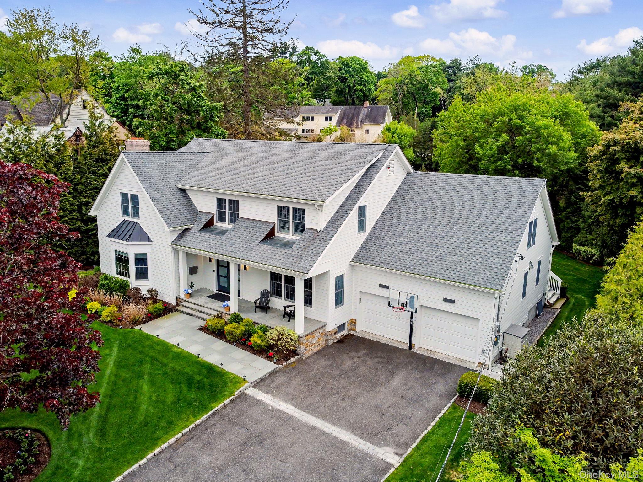 This sophisticated Colonial in Scarsdale’s prestigious Grange estate o...