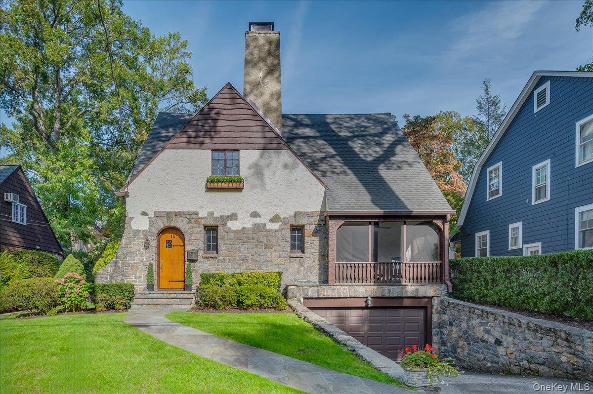 Move right in to this charming Tudor situated on a quiet, tree-lined s...