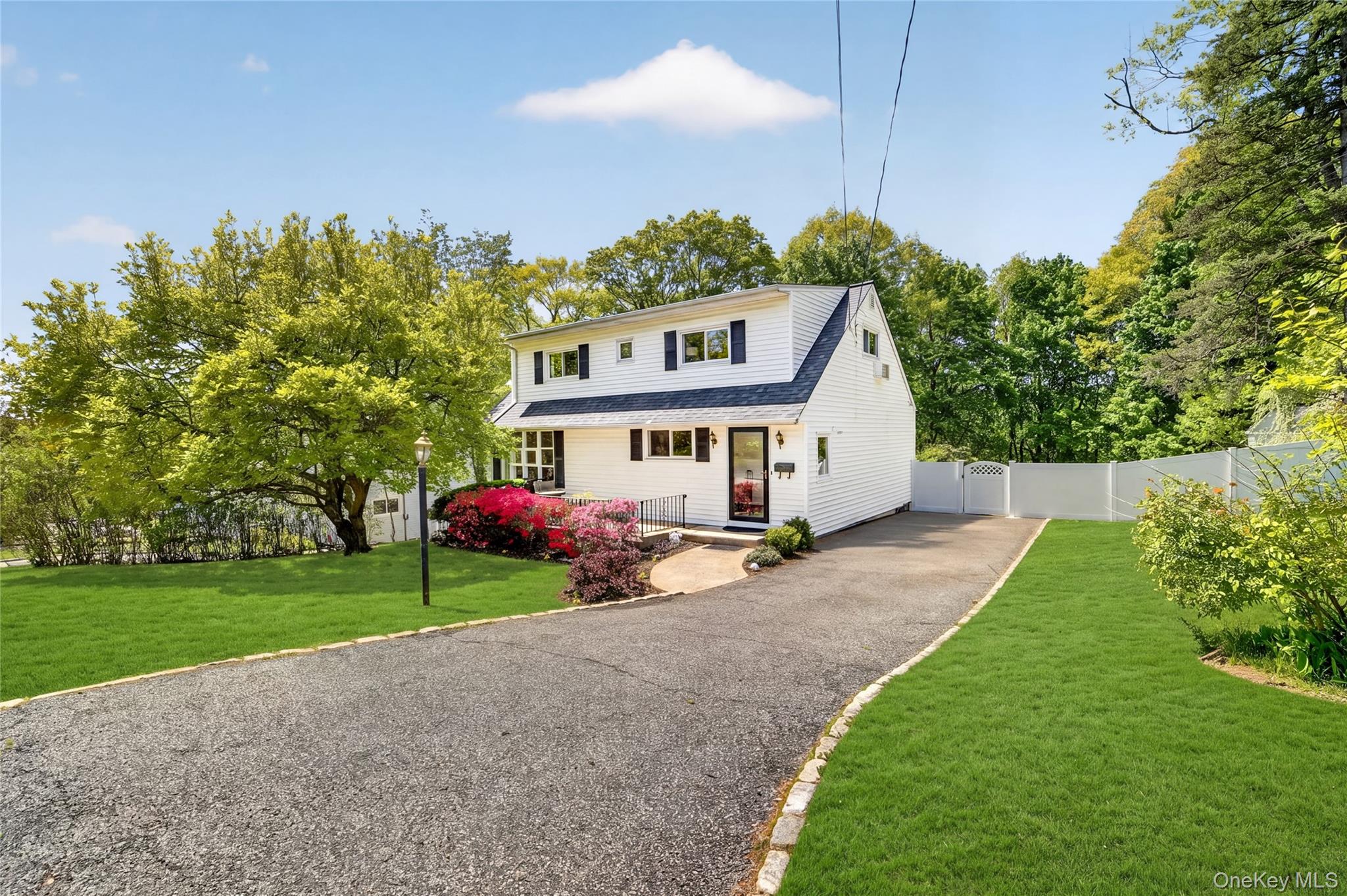 Set on an oversized and exceptionally private nearly half-acre propert...