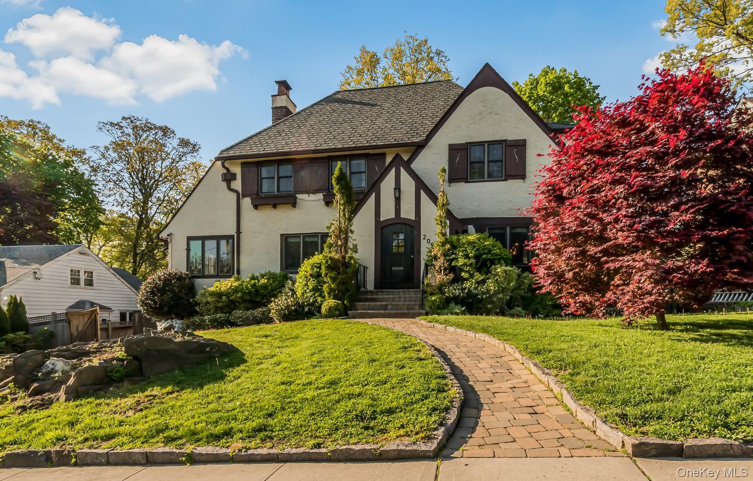 Welcome to this stunning 4 bedroom Tudor in the heart of Glenwood Lake...