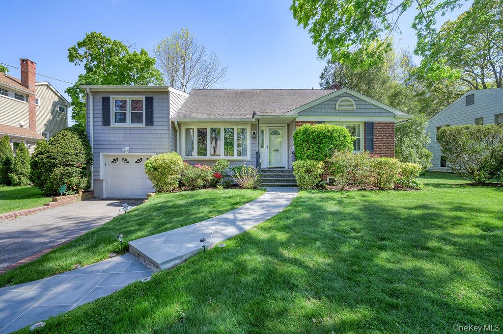 Immaculate Split-Level home nestled on a quiet street in the desirable...