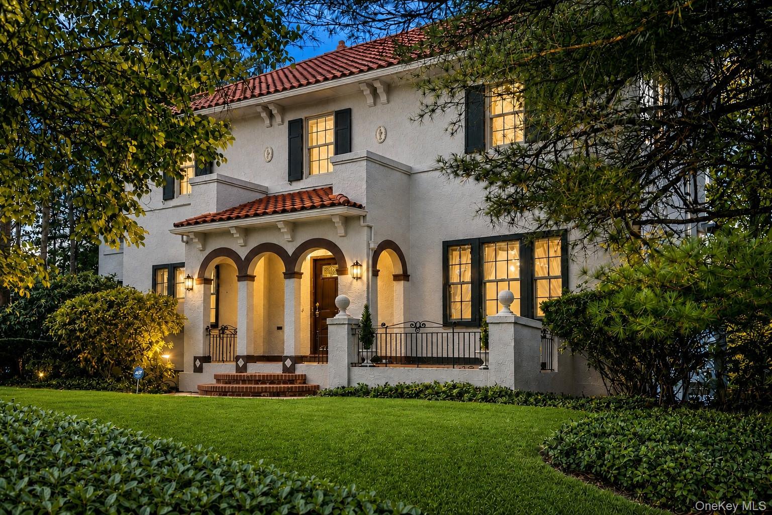 This stately Mediterranean villa near Bronxville is set high on a priv...