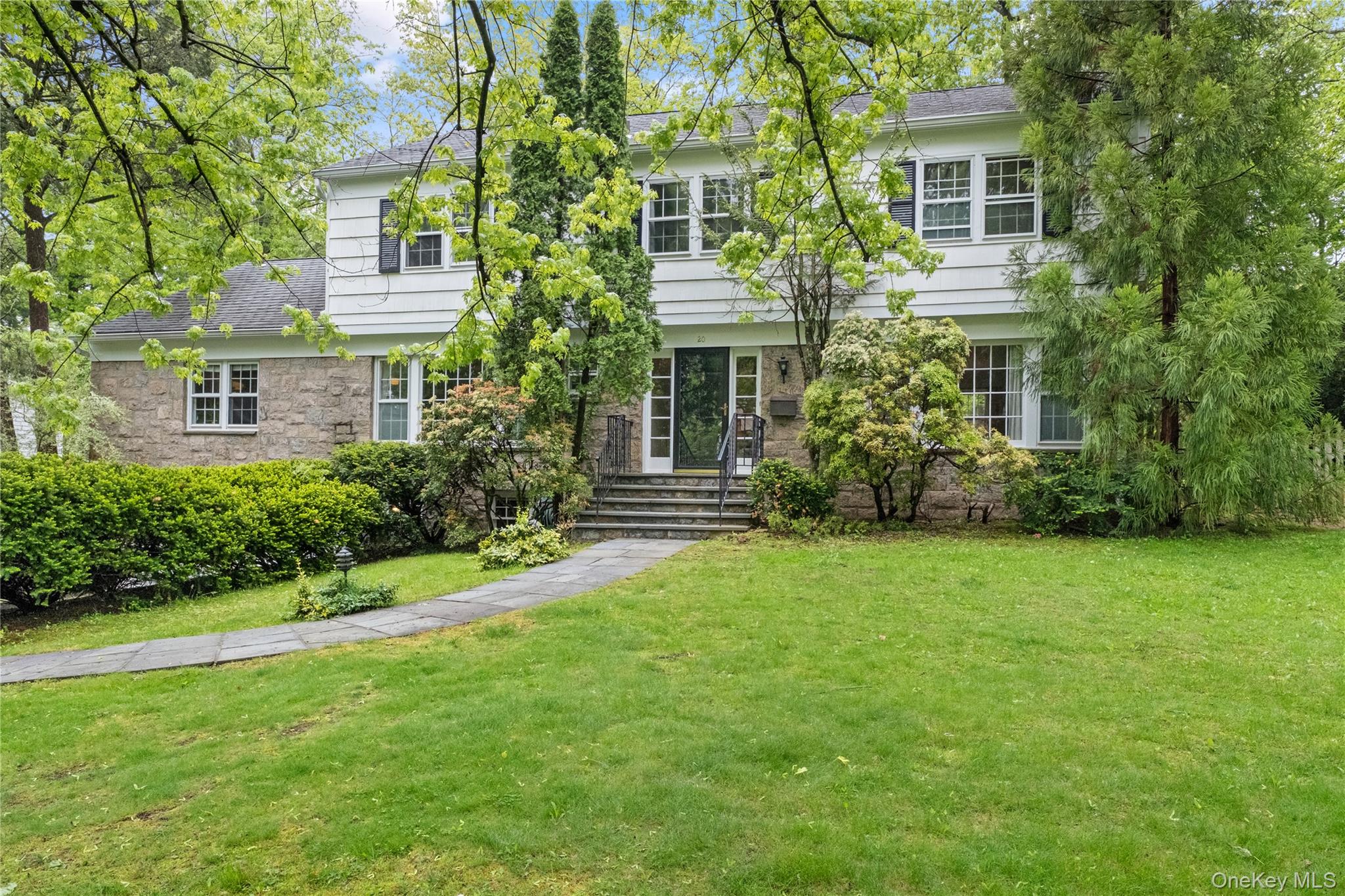 Welcome to this classic Center Hall Colonial in move-in condition situ...
