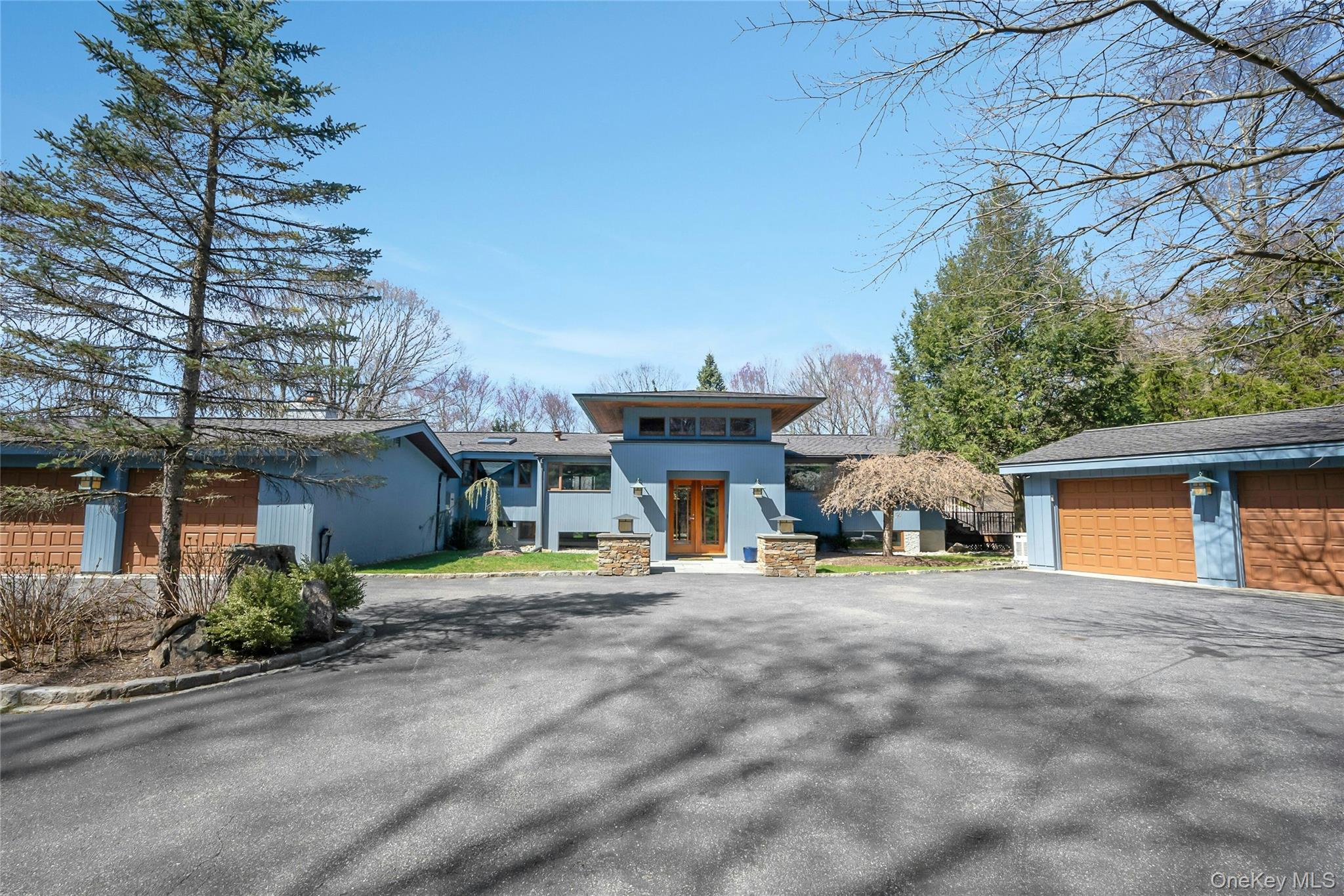 Experience true serenity in this stunning modern retreat in the woods...