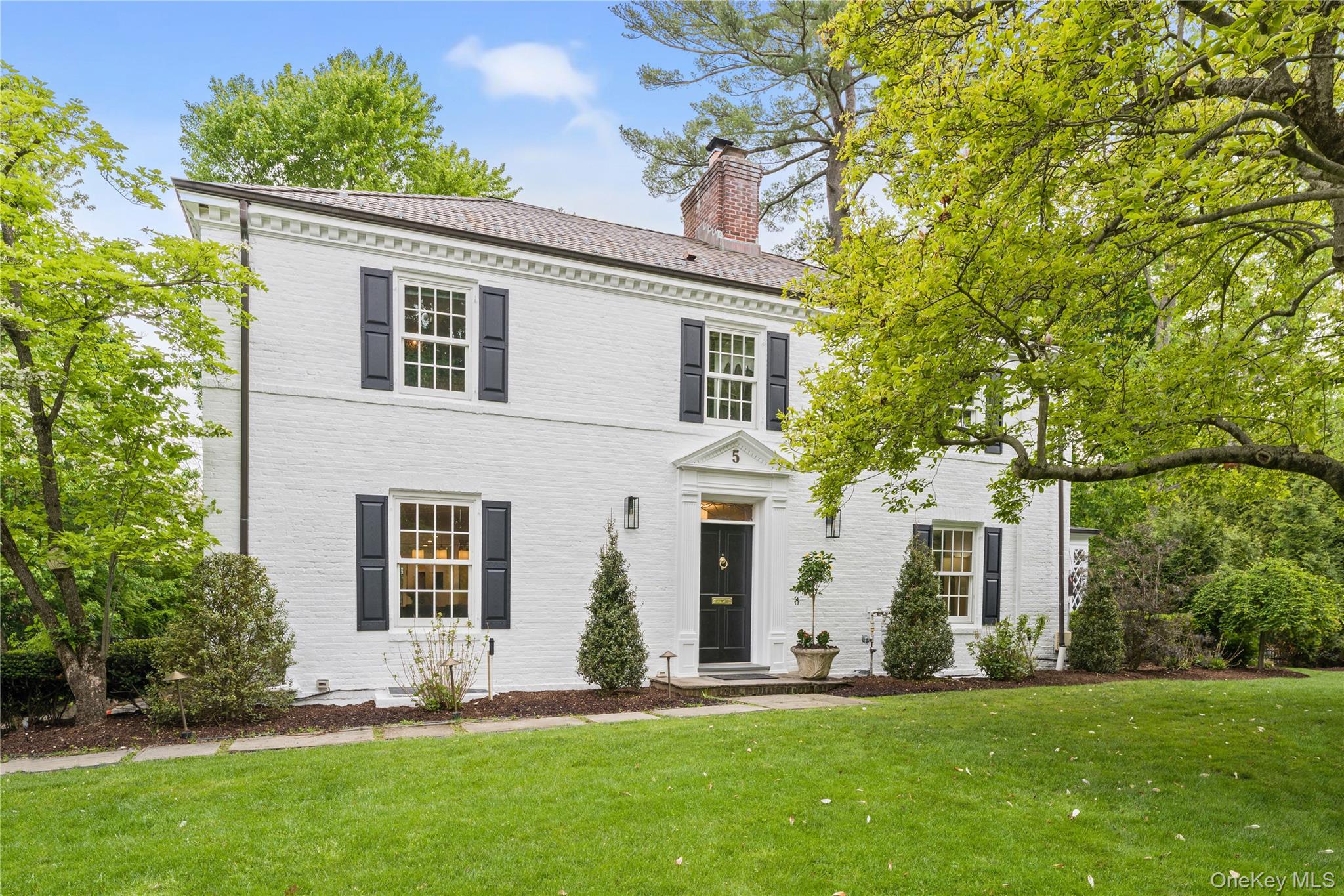 Coveted and classic center hall Colonial set in an outstanding Fox Mea...