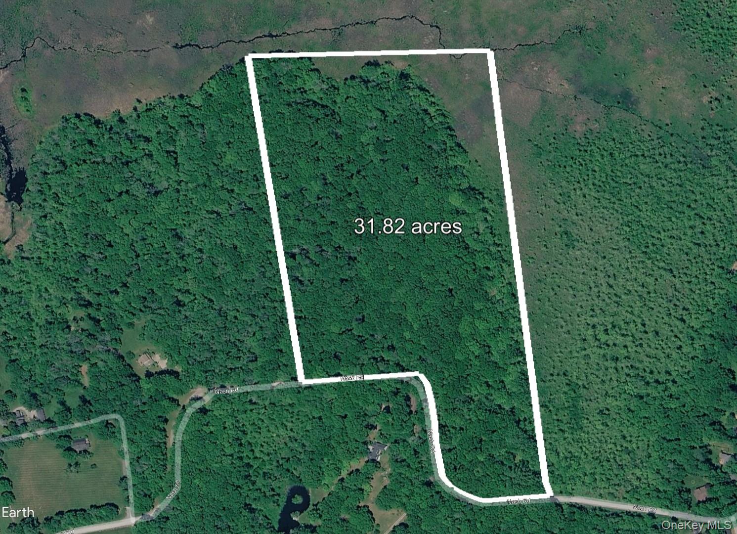 Discover serene privacy on this 31.82-acre wooded parcel along Nash Ro...