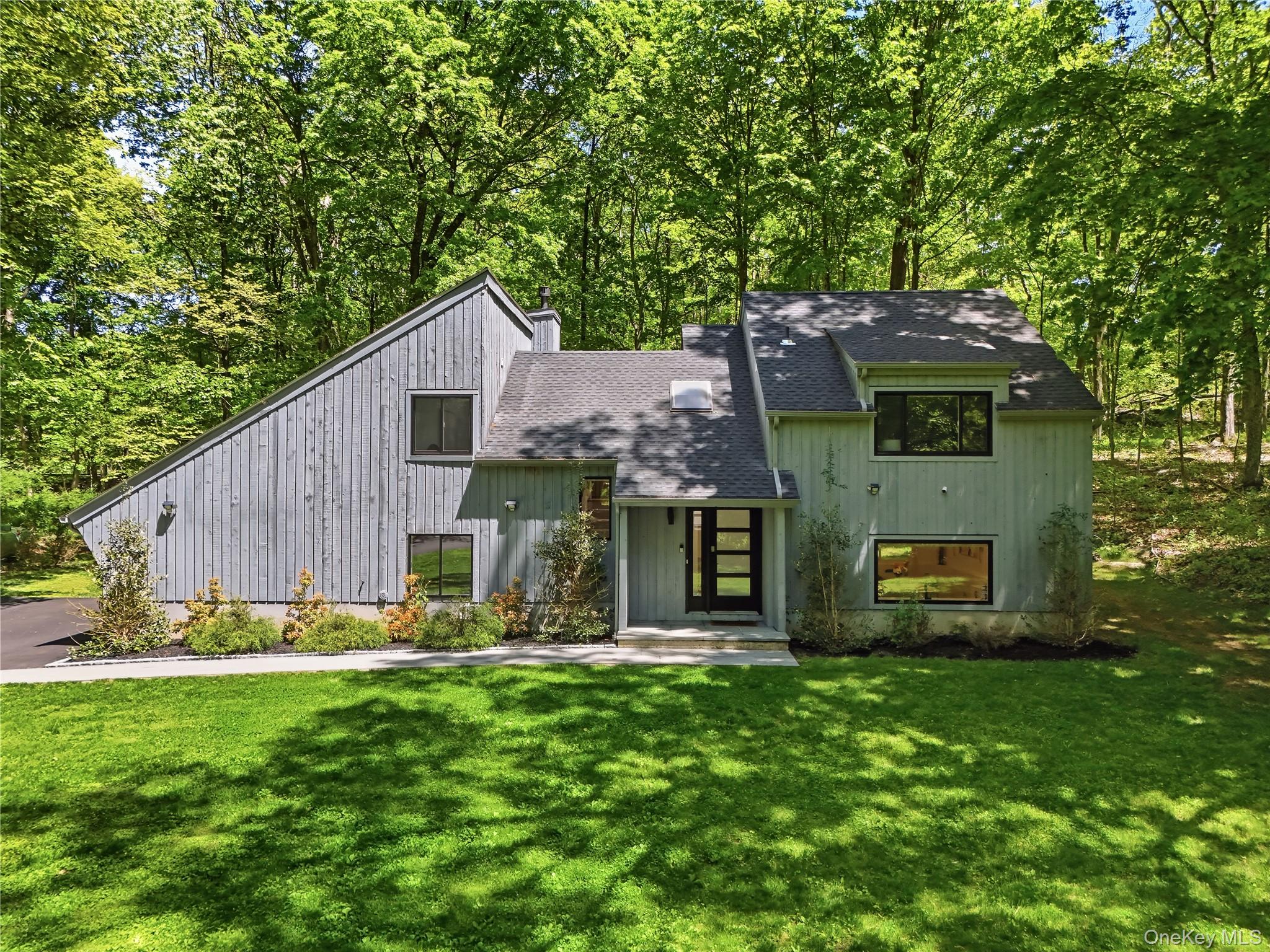 Experience true serenity in this stunning modern retreat set on over t...
