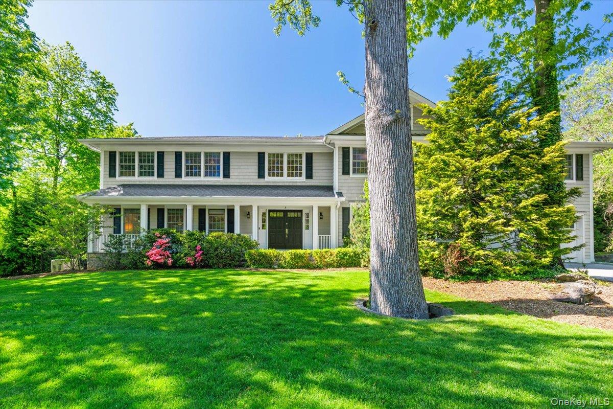 Located on a picturesque tree-lined street in the coveted Murdock Wood...