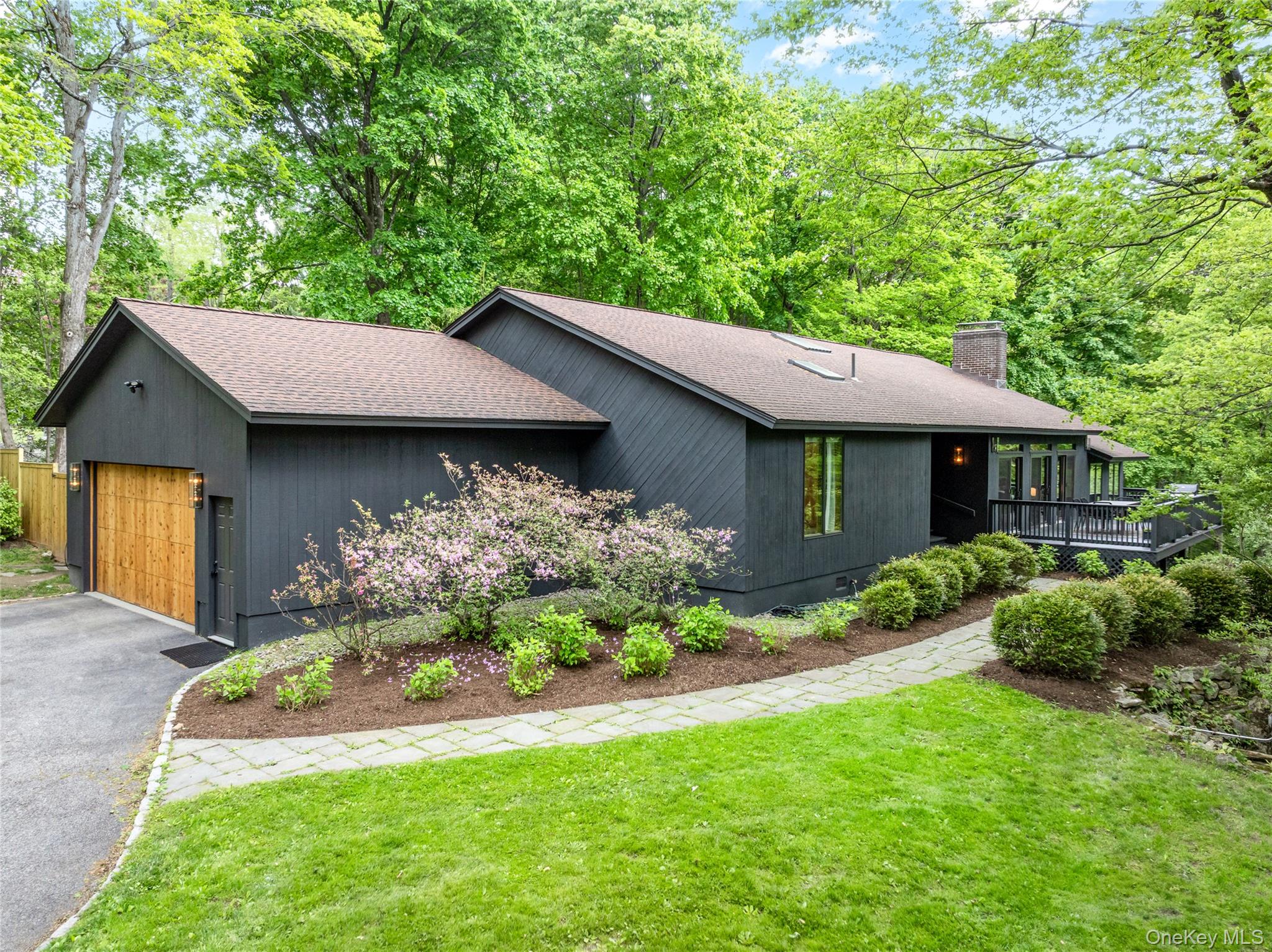 Set on over an acre of private, bucolic property, this spacious mid-ce...