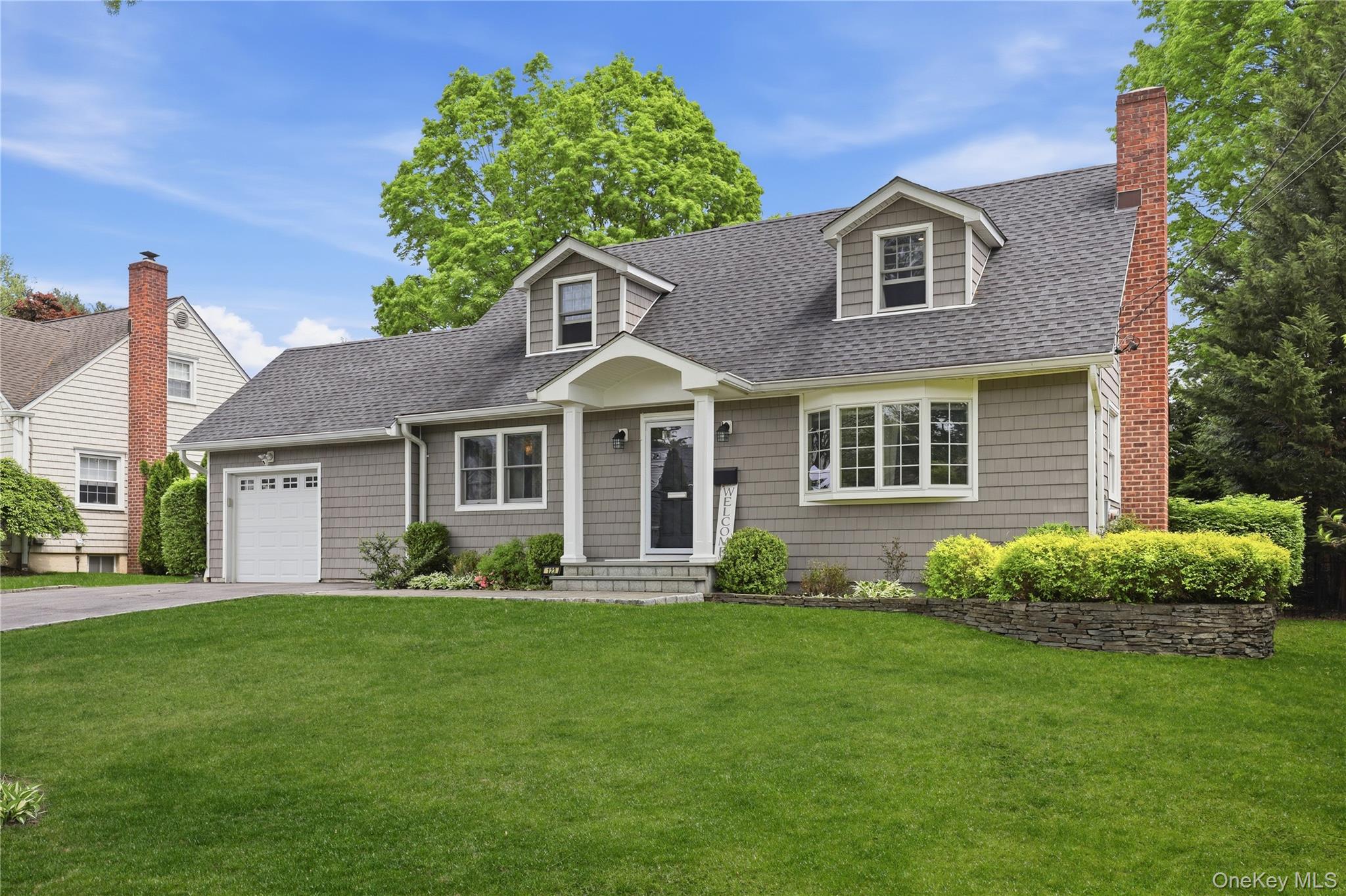 Welcome to 123 Hilburn, a light-filled Cape-style home perfectly locat...