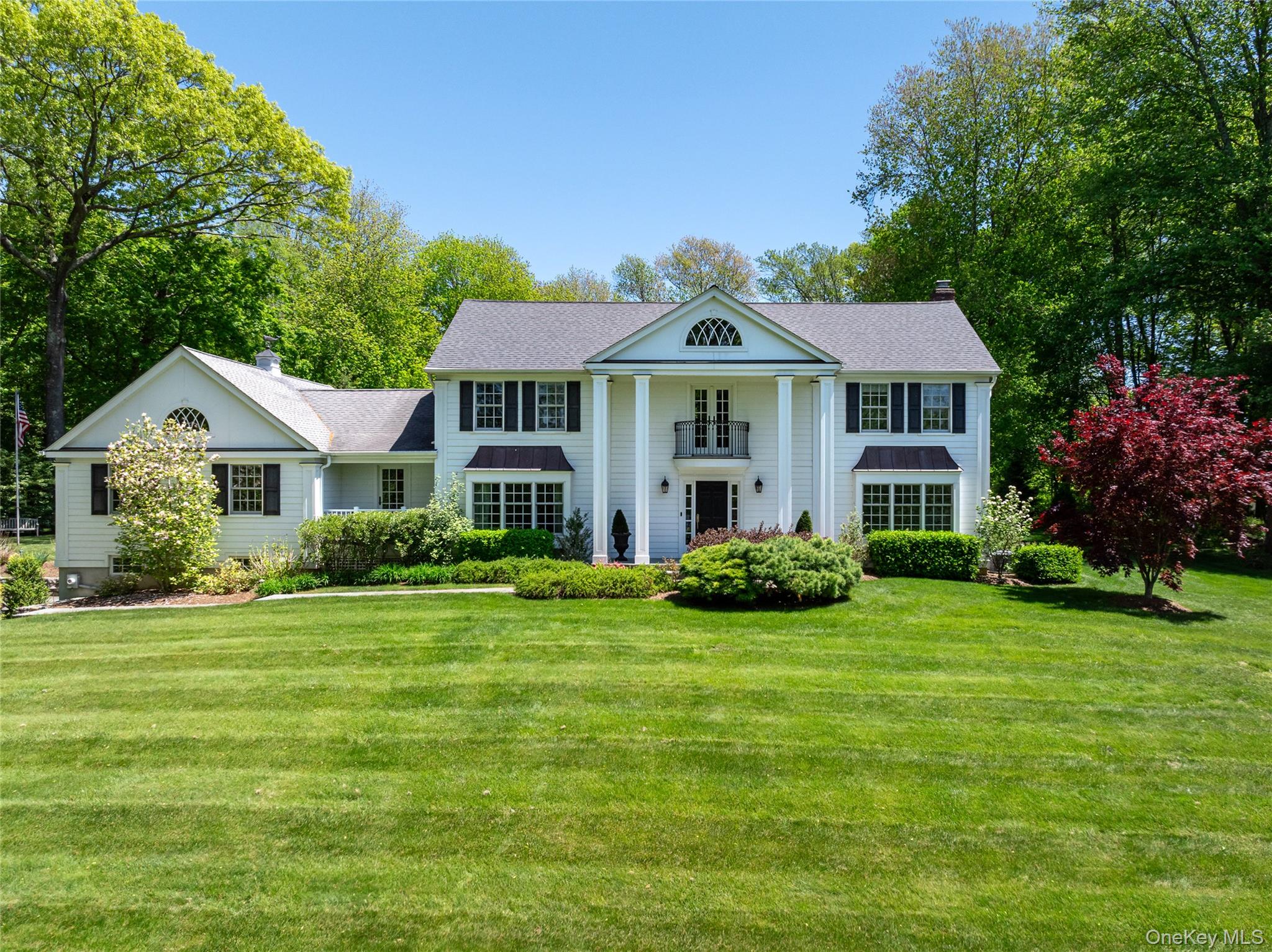 Gracefully set on nearly two spectacular acres overlooking the shimmer...