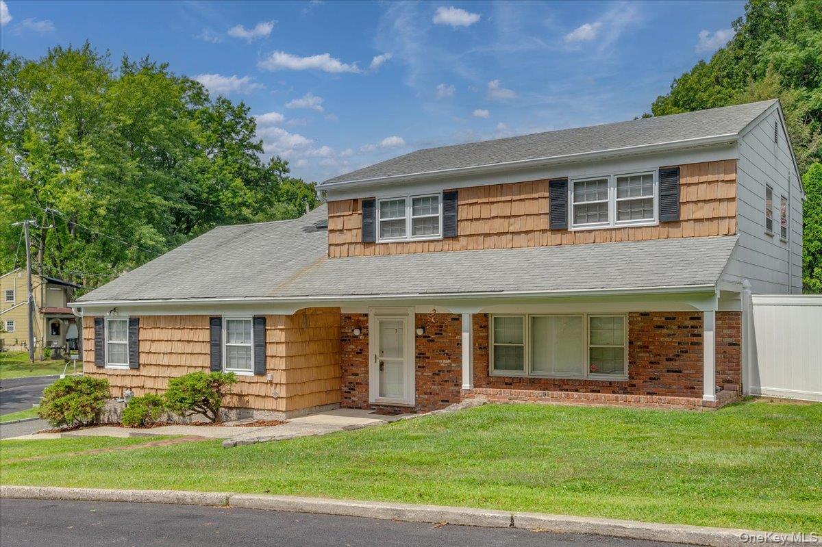 Welcome to 7 Shaw Lane, a turnkey side hall Colonial located in the Ir...