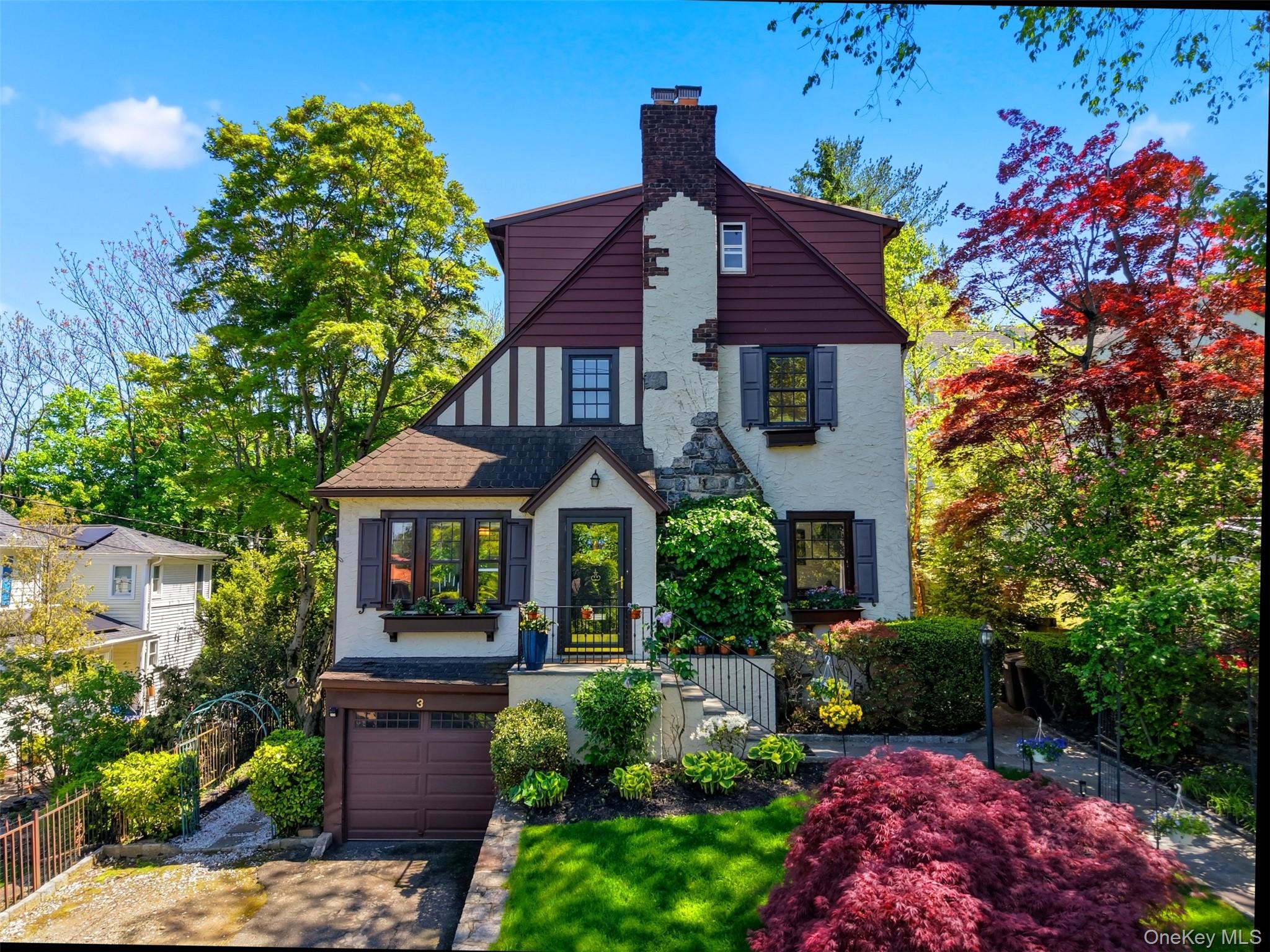 This beautifully maintained Tudor-style residence offers approximately...