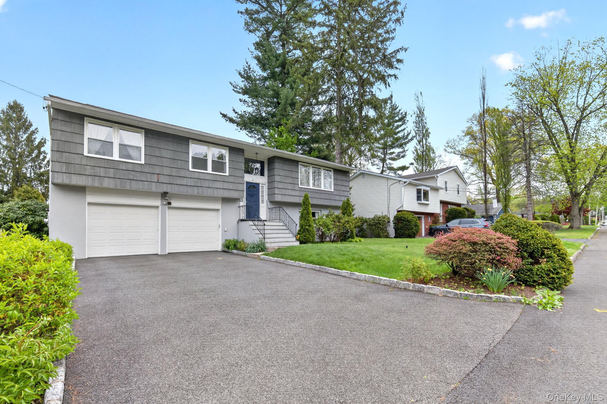 Welcome to 7 Frost Lane, Hartsdale NY. A modern Home offering a sophis...