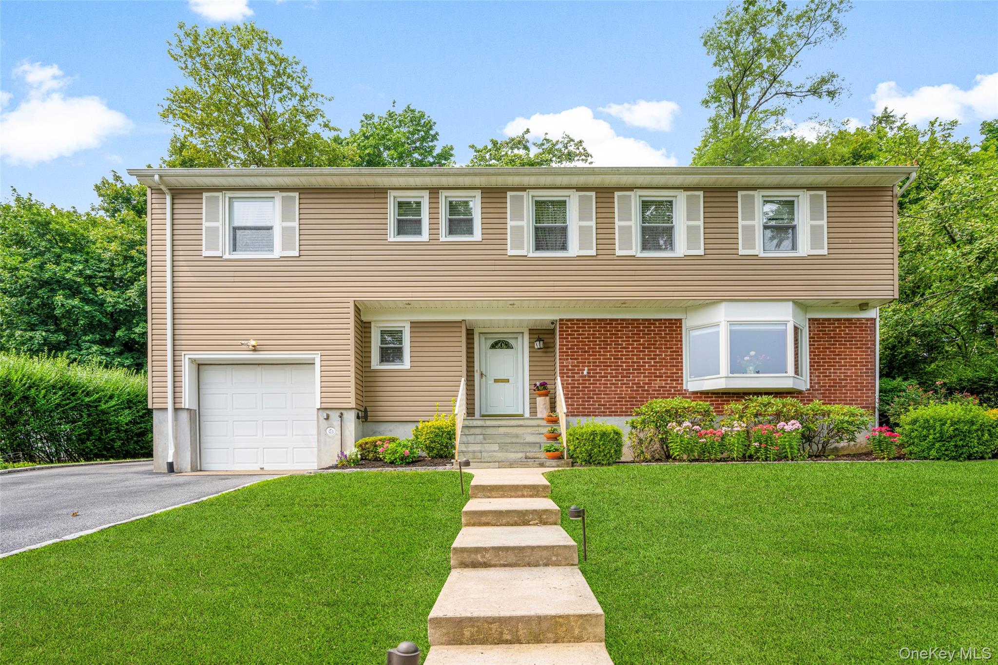 Nestled on a quiet cul-de-sac in desirable Hilltop Farms, this beautif...