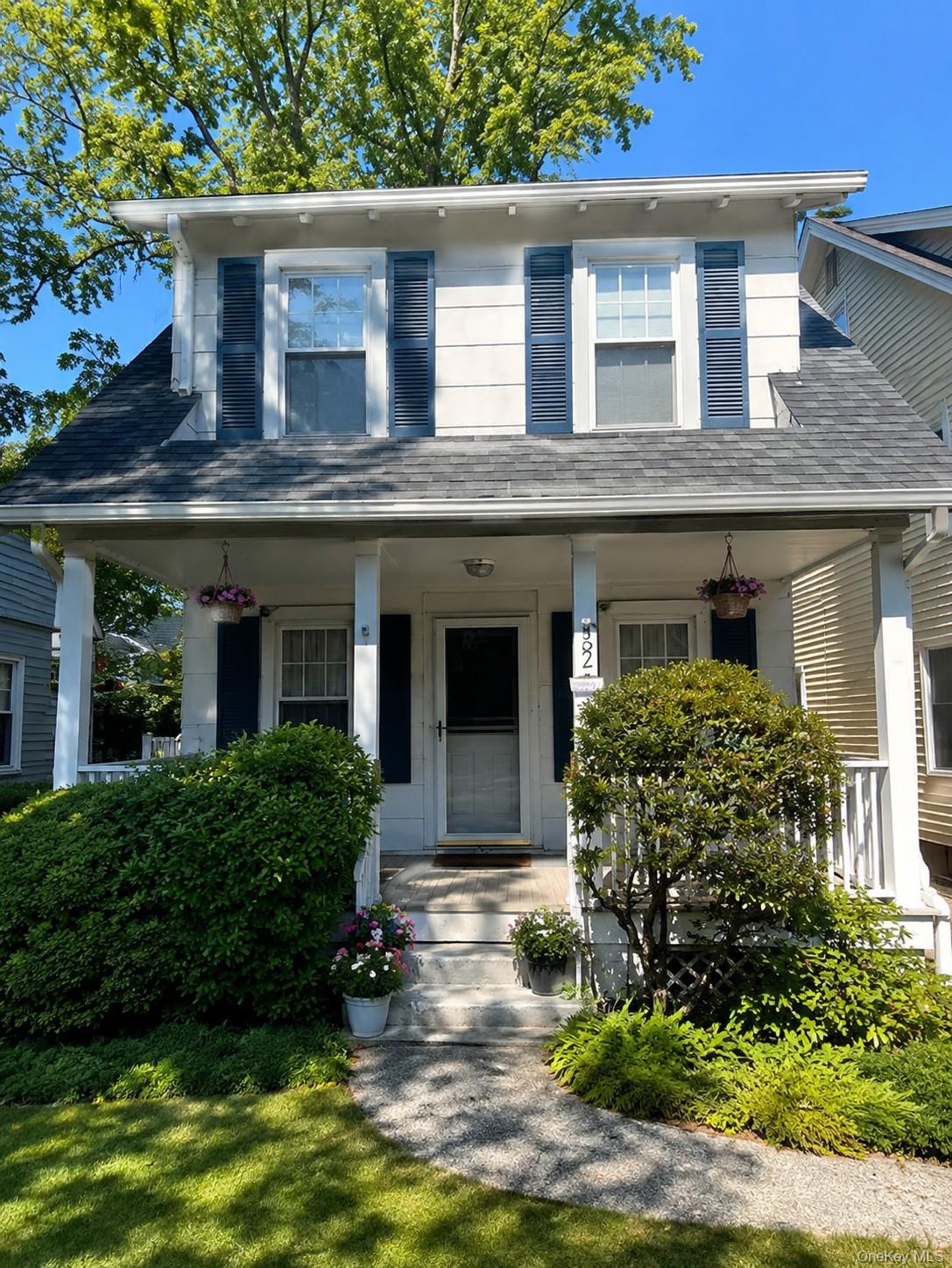 Welcome home to this lovely, front-porch Colonial perfectly situated i...
