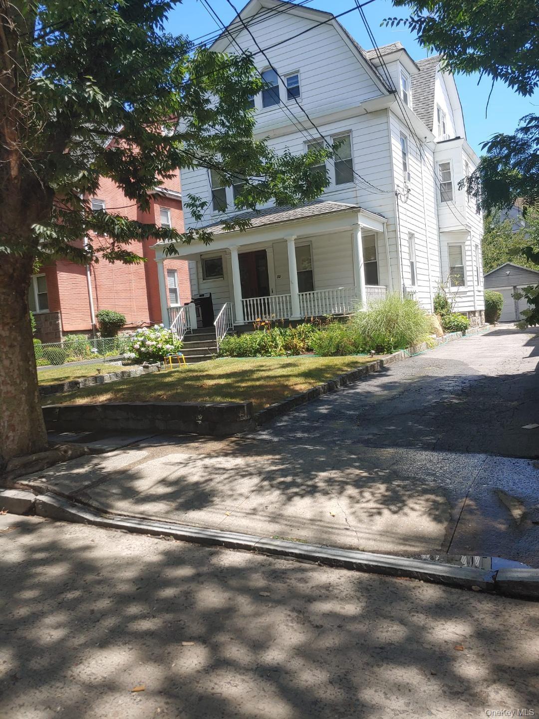 Turnkey three-family investment property with additional studio locate...
